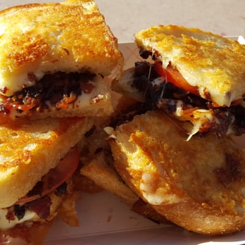 Stripchezze - Jam On It sliced into four pieces. The bacon jam is still calling my name. - Food Trucks Near Me