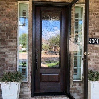 Cambridge Doors & Windows - New door with storm door opened - Windows Installation Near Me - Stafford, Texas