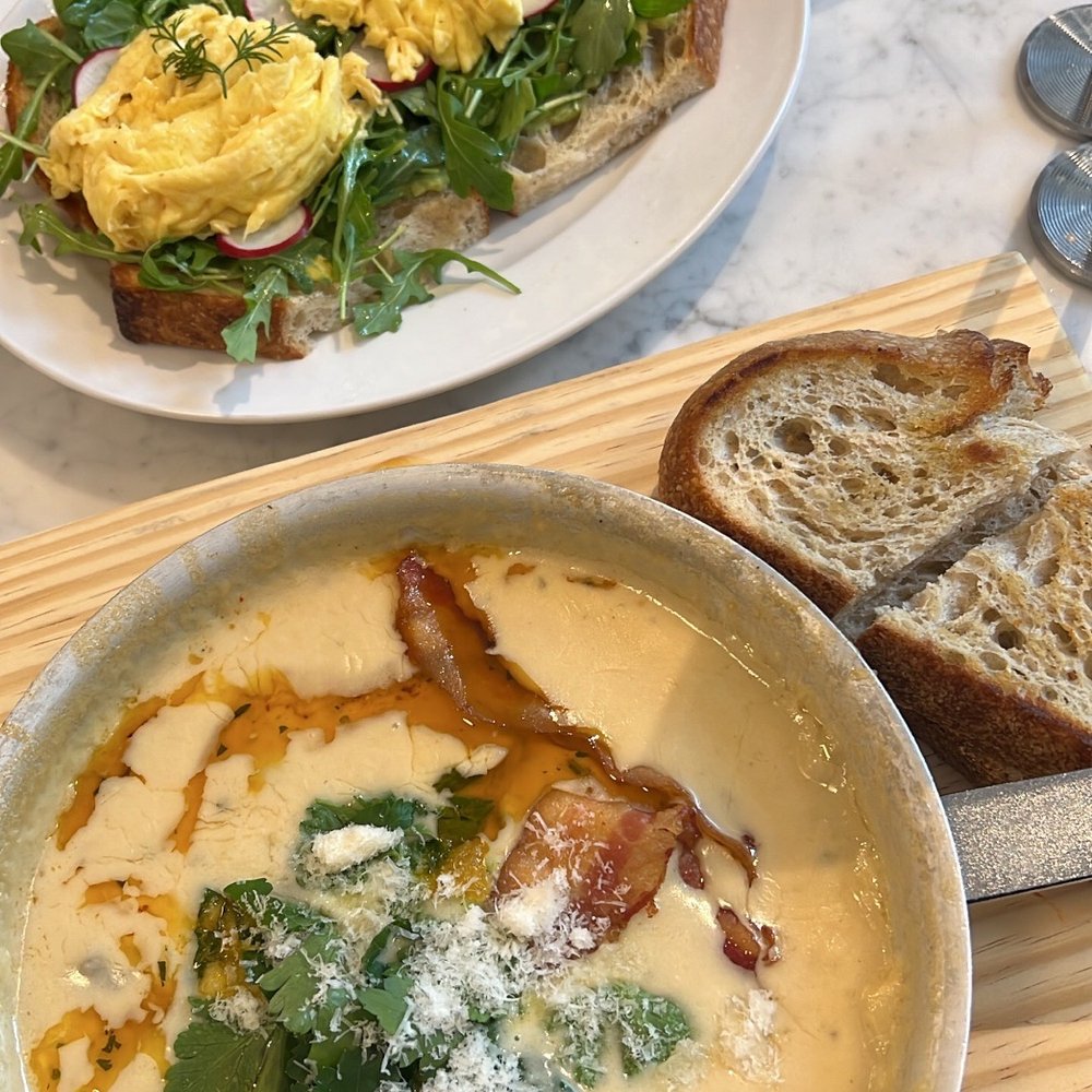 Tatte Bakery & Cafe | Assembly Row - Bacon, potato, and mushroom shakshuka and avocado tartine. - Breakfast & Brunch Near Me - Somerville, Massachusetts Tatte Bakery & Cafe | Assembly Row - Bacon, potato, and mushroom shakshuka and avocado tartine. - Breakfast & Brunch Near Me - Somerville, Massachusetts