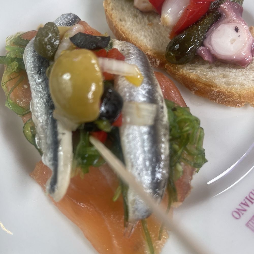 Casa del Indiano - Left: salmon , olive, anchovy pretty tasty  Right: octopus, red pepper, olive, onion, and pickle - Diners Near Me - Santander, S