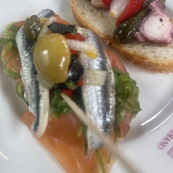 Casa del Indiano - Left: salmon , olive, anchovy pretty tasty  Right: octopus, red pepper, olive, onion, and pickle - Diners Near Me - Santander, S
