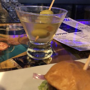 Reset - a burger and a martini on a table - Arcades Near Me - Toledo, Ohio
