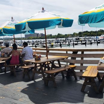 Nicks Fish House - Outdoor benches with umbrella - Seafood Near Me - Baltimore, Maryland Nicks Fish House - Outdoor benches with umbrella - Seafood Near Me - Baltimore, Maryland