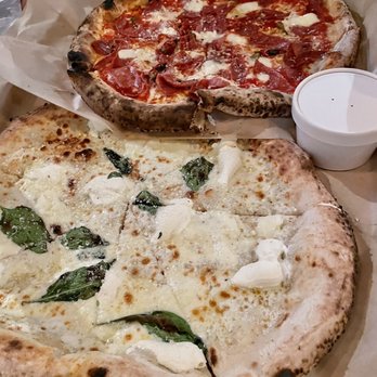 Antico Pizza - Diavola Pizza (back) and a basic white pizza (front) - Pizza Near Me - Atlanta, Georgia Antico Pizza - Diavola Pizza (back) and a basic white pizza (front) - Pizza Near Me - Atlanta, Georgia