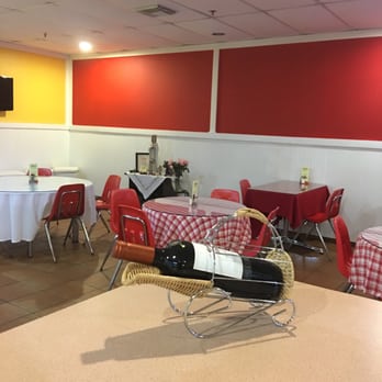 Rikin Cafeteria - tables, chairs, and a wine rack - Caterers Near Me - Miami, Florida Rikin Cafeteria - tables, chairs, and a wine rack - Caterers Near Me - Miami, Florida