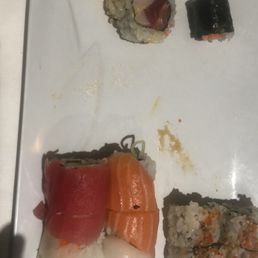 a plate of sushi and rolls a plate of sushi and rolls