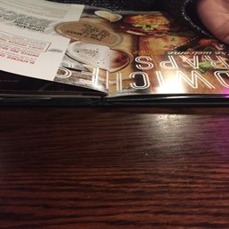 a person holding a menu