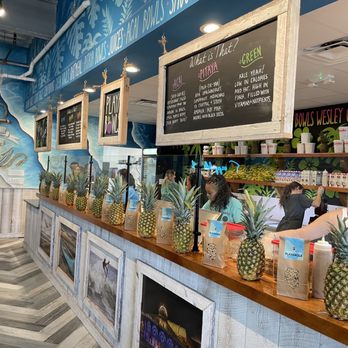 Playa Bowls - a variety of pineapples on display - Acai Bowls Near Me - Wesley Chapel, Florida