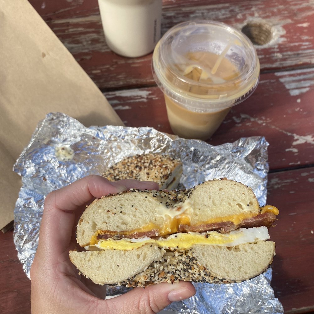 Rosen's Bagels - a person holding a sandwich - Bagels Near Me - Austin, Texas Rosen's Bagels - a person holding a sandwich - Bagels Near Me - Austin, Texas