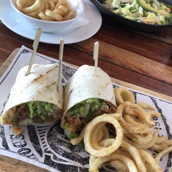 Hog's Australia's Steakhouse - Vegan Schnitzel Wrap (Tomato Sauce, not like dressing) with Curly Fries. Grilled Chicken Caesar Salad with a side of Curly Fries. - Steakhouses Near Me - Loganholme, QLD