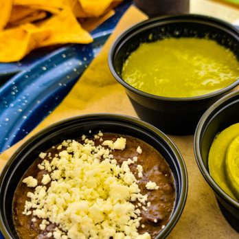 Nixta Taqueria - Heirloom corn Chips + duck fat black beans & (green) salsa crudo, with add-on guacamole - Mexican Near Me - Austin, Texas Nixta Taqueria - Heirloom corn Chips + duck fat black beans & (green) salsa crudo, with add-on guacamole - Mexican Near Me - Austin, Texas