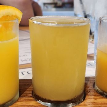 Kitchen Social - Mimosa Flight. Orange, Pineapple and Mango/Cherry. - Desserts Near Me - Cincinnati, Ohio Kitchen Social - Mimosa Flight. Orange, Pineapple and Mango/Cherry. - Desserts Near Me - Cincinnati, Ohio