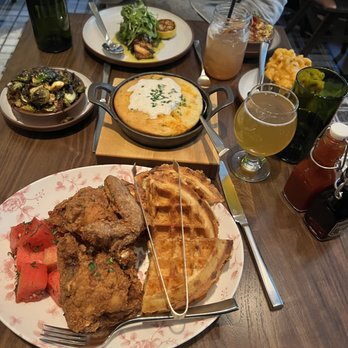 Yardbird Table & Bar - Chicken and waffles, corn bread, Salmon w/sautéed Spinach, Mac and Cheese, Crispy Brussels, and street corn. - New American Near Me - Chicago, Illinois Yardbird Table & Bar - Chicken and waffles, corn bread, Salmon w/sautéed Spinach, Mac and Cheese, Crispy Brussels, and street corn. - New American Near Me - Chicago, Illinois