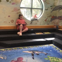 Navarre Library - Ava enjoying her reading time