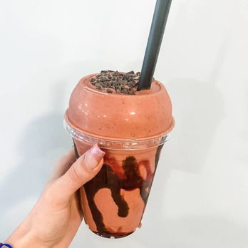 Charged Ansonia  -  hand holding a chocolate milkshake - Juice Bars & Smoothies Near Me - Ansonia, Connecticut