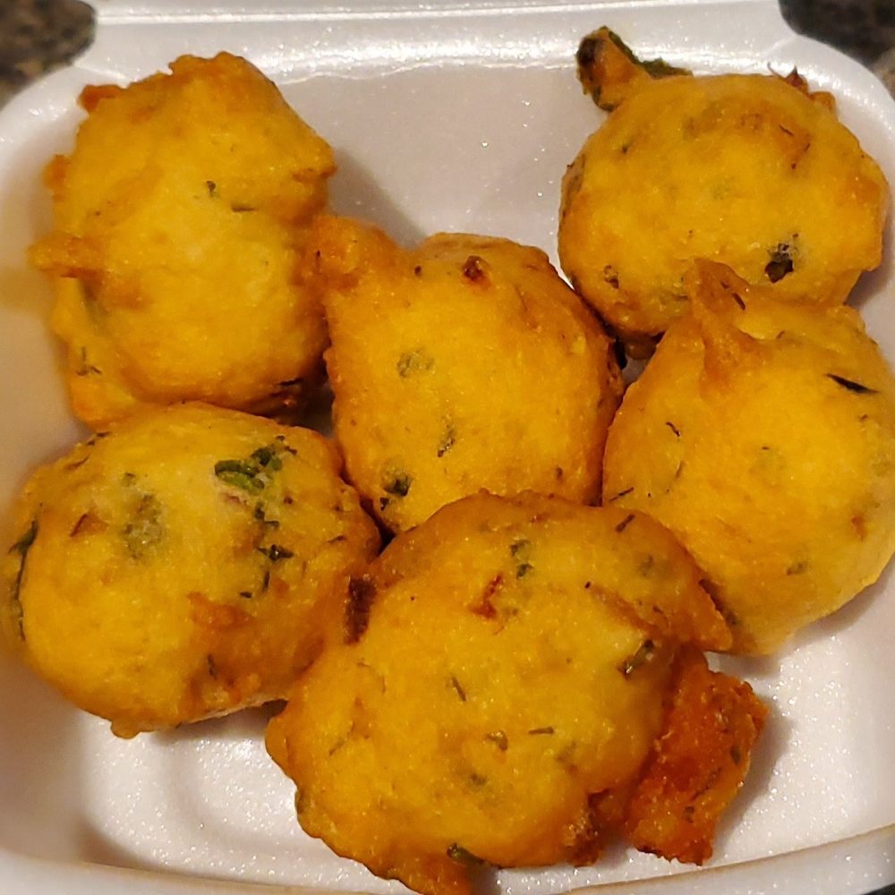 Spices Hut - Hot fresh punugulu (lentil fritters) at the snack counter inside the grocery store - Grocery Near Me - Framingham, Massachusetts Spices Hut - Hot fresh punugulu (lentil fritters) at the snack counter inside the grocery store - Grocery Near Me - Framingham, Massachusetts