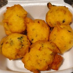 Spices Hut - Hot fresh punugulu (lentil fritters) at the snack counter inside the grocery store