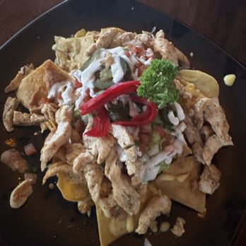 Eco Bar & Grill - Loaded chicken nachos. Looks like a lot of chicken at the top, however this was deceiving as we ran out of chicken quickly. - Mexican Near Me - Cabo San Lucas, BCS Eco Bar & Grill - Loaded chicken nachos. Looks like a lot of chicken at the top, however this was deceiving as we ran out of chicken quickly. - Mexican Near Me - Cabo San Lucas, BCS