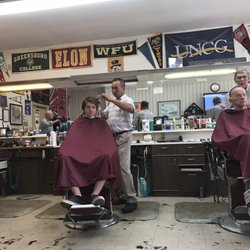 Gene's Styling & Barber Service - I love all of the college flags, it adds lots of personality to this place!