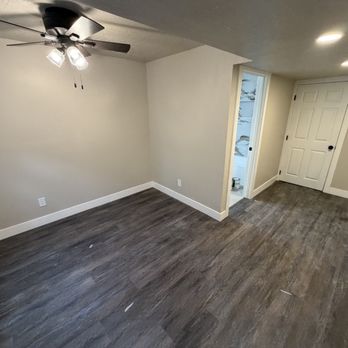 Surge Construction Services - Basement finish with new flooring, trim, lighting, and completed living space. - Handyman Near Me - Lehi, Utah Surge Construction Services - Basement finish with new flooring, trim, lighting, and completed living space. - Handyman Near Me - Lehi, Utah