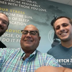 Stretch Zone - Brian Benge, Stretch Practitioner/Manager, Tony L, Nick Vankleeck, General Manager/Stretch Practitioner, in the reception area.