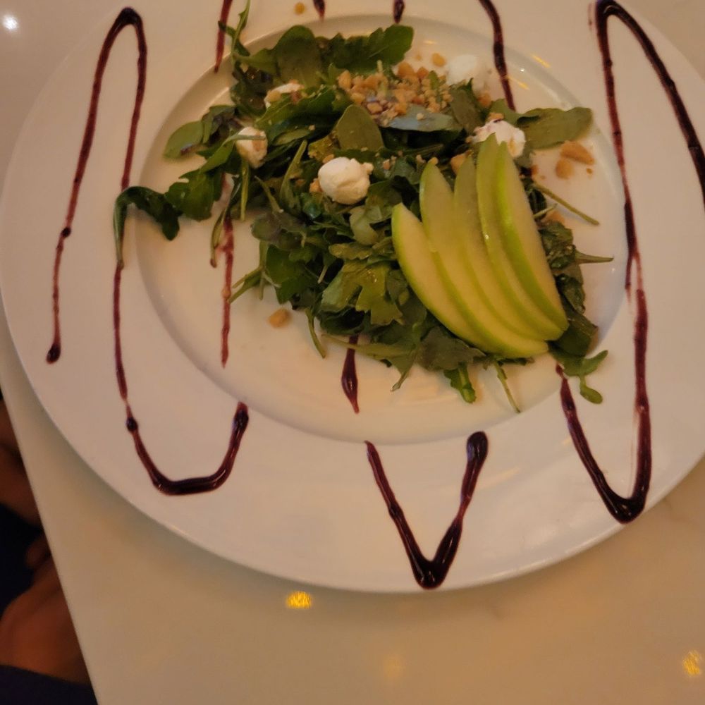 Bocca Italian Kitchen - Arugla salad for one of my co-workers Arugula Goat Cheese, Apple, Toasted Macadamia Nuts, Blackberry Balsamic Vinaigrette - Italian Near Me - Houston, Texas