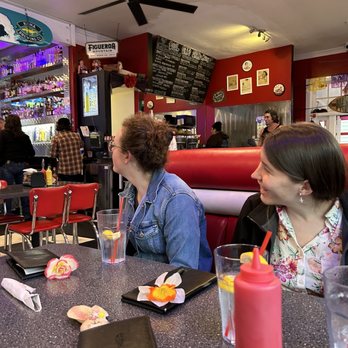 Cool Cat Cafe - Watching the ice hockey game on Friday night - American Near Me - Pismo Beach, California Cool Cat Cafe - Watching the ice hockey game on Friday night - American Near Me - Pismo Beach, California