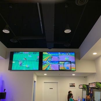 Penguin Bros - two people playing a video game - Coffee & Tea Near Me - Richmond, British Columbia
