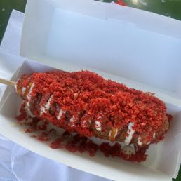 Hot Cheeto corn dog with sweet chili and garlic aioli