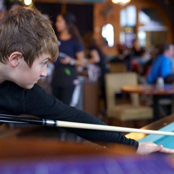 Molly Hogan's Bar & Grill - a boy playing pool - Sports Bars Near Me - Agassiz, British Columbia Molly Hogan's Bar & Grill - a boy playing pool - Sports Bars Near Me - Agassiz, British Columbia