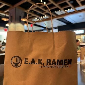 EAK Ramen - a brown paper bag with the e a k ramen logo on it - Ramen Near Me - New York, New York EAK Ramen - a brown paper bag with the e a k ramen logo on it - Ramen Near Me - New York, New York