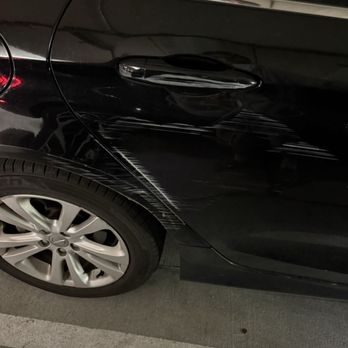 Solomon - One of many cars that has hit a concrete pole trying to avoid others entering and exiting - Apartments Near Me - Austin, Texas