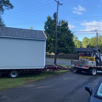 Hometown Structures - a house being towed by a tow truck - General Contractors Near Me - Westfield, Massachusetts