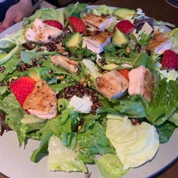 JOEY Polo Park - a plate of salad with chicken, avocado, and strawberries - Canadian (New) Near Me - Winnipeg, Manitoba