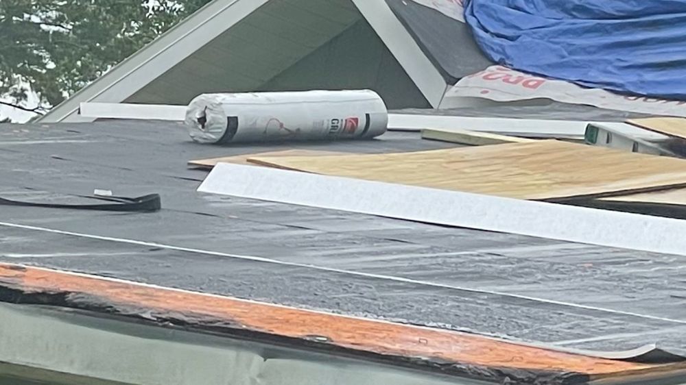 Slide of Tadlock Roofing