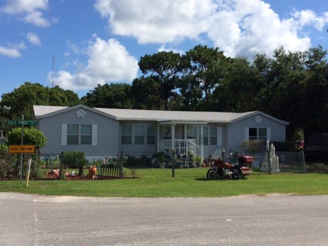 Slide of Greg's Roofing Of Bay County