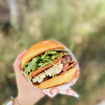 Cargo Snack Shack - a hand holding a sandwich - Burgers Near Me - Los Angeles, California Cargo Snack Shack - a hand holding a sandwich - Burgers Near Me - Los Angeles, California
