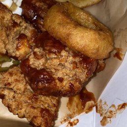 a close up of a box of fried food