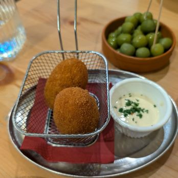 Sora Lella - Suppli Romani, olives in the background. - Italian Near Me - Edinburgh, EDH