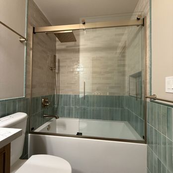Luxury Construction - new bathtub and shower door insertion - General Contractors Near Me