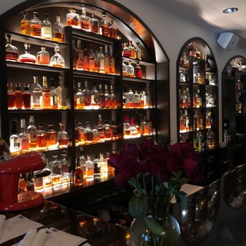 ROC Restaurant - a bar with bottles of liquor - Italian Near Me - Louisville, Kentucky ROC Restaurant - a bar with bottles of liquor - Italian Near Me - Louisville, Kentucky