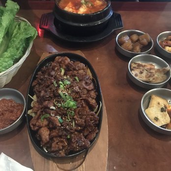 Dawon - Dwajee bulgogi (marinated pork) and banchan. Kimchi jjigae in the back - Korean Near Me - Allen, Texas