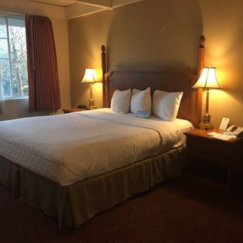 Prodigy Hotel, a Days Inn by Wyndham - Convenient charging outlets on nightstand - Hotels Near Me - Davis, California