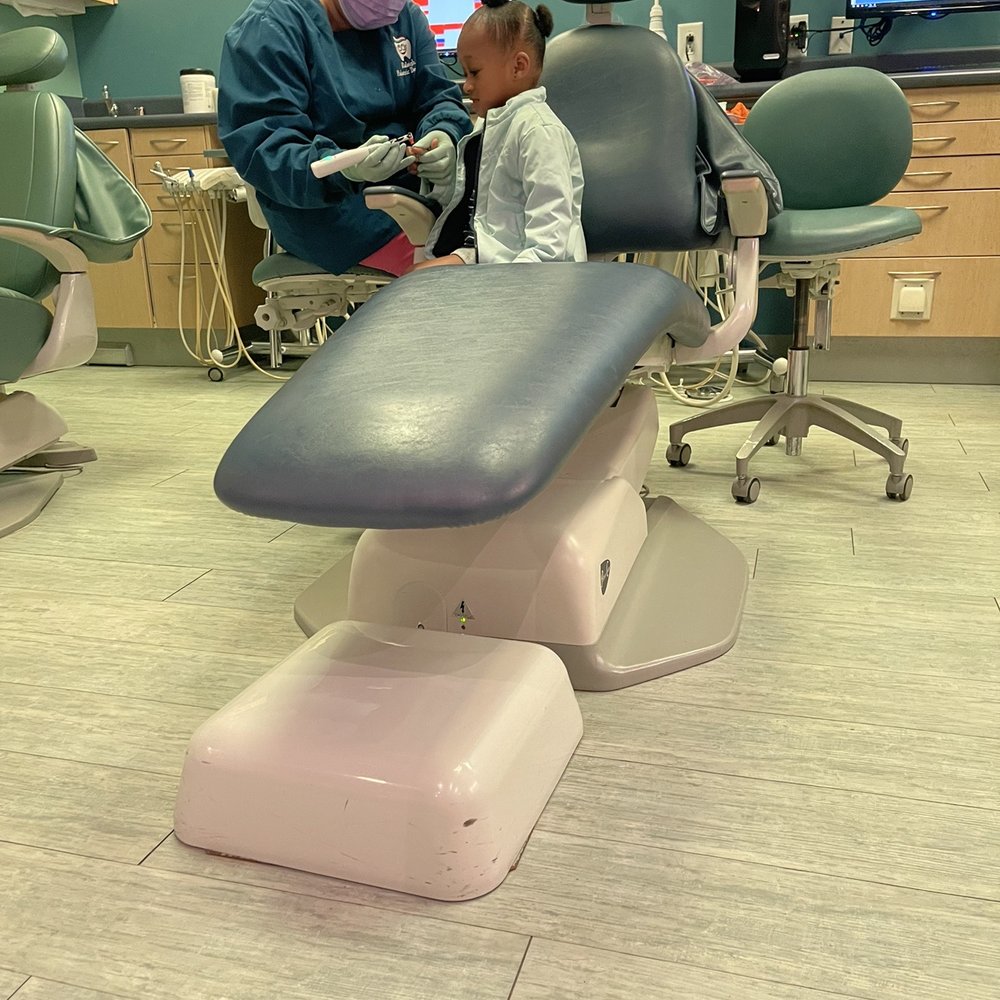 Raleigh Pediatric Dentistry - Showing her the tools - Pediatric Dentists Near Me - Raleigh, North Carolina