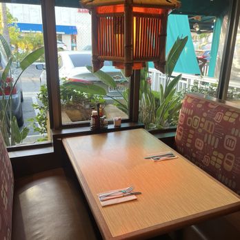 Canoe House - An empty booth with an orange colored lantern hanging above. - Hawaiian Near Me - South Pasadena, California Canoe House - An empty booth with an orange colored lantern hanging above. - Hawaiian Near Me - South Pasadena, California