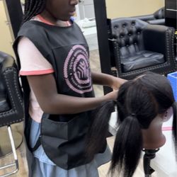 Youth Braiding Academy - 9 years old becka learning how to section hair.