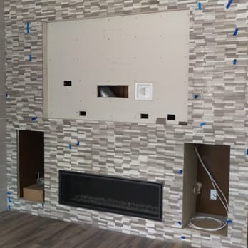Canyon Fireplace - Everywhere you see blue tape is a loose tile.  Seriously... - Fireplace Services Near Me - Orange, California
