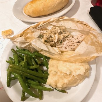 Roberto's River Road Restaurant - Fish en Papillote- catch of the day with herbs and lemon in the traditional French style, topped with jumbo lump crab meat - Cajun/Creole Near Me - Sunshine, Louisiana Roberto's River Road Restaurant - Fish en Papillote- catch of the day with herbs and lemon in the traditional French style, topped with jumbo lump crab meat - Cajun/Creole Near Me - Sunshine, Louisiana