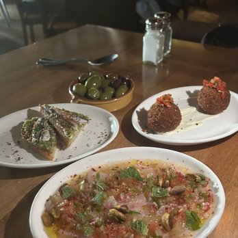 Costera - Course 1. Citrus and Vermouth Marinated olives. Bombas. Boquerones w/ sourdough bread. American Red Snapper Crudo - Spanish Near Me - New Orleans, Louisiana