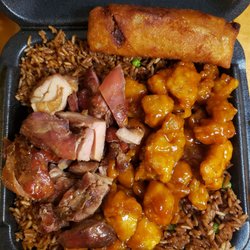 Sarku Japan - Chinese food with egg roll over fried rice